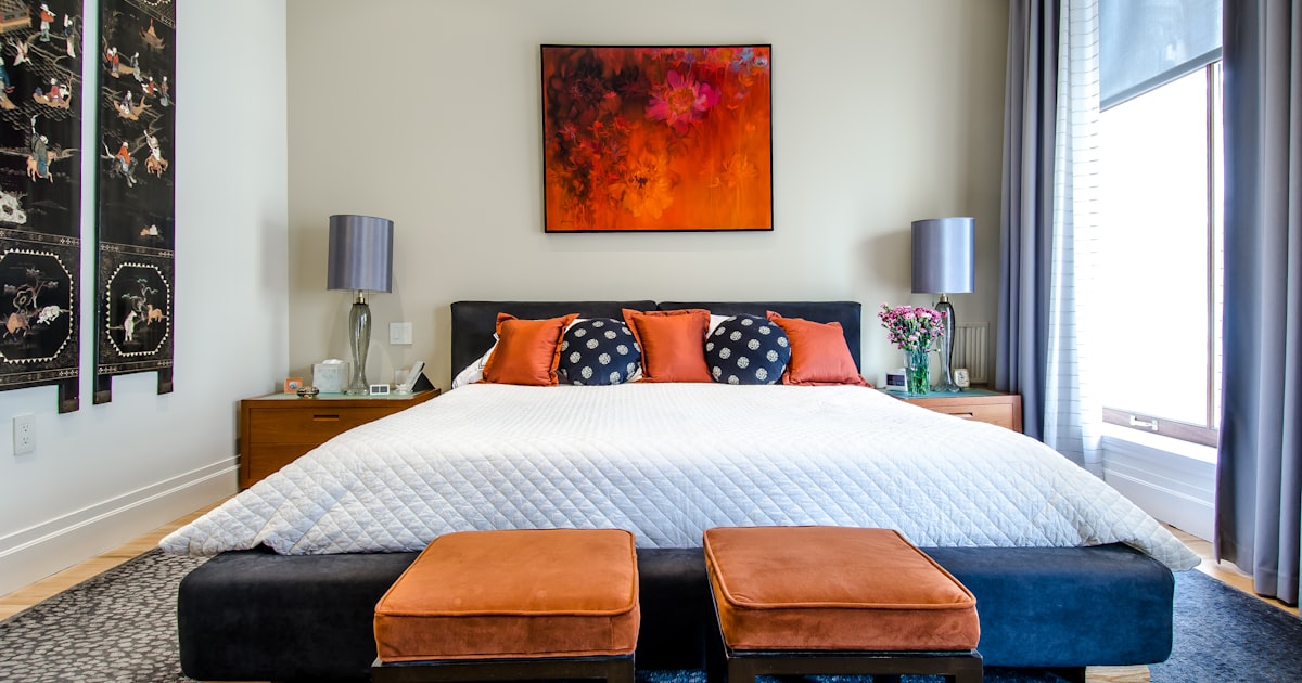 Bedroom with soft lighting and a neatly made bed